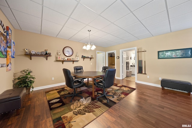 627 10th Ave, Silvis, IL 61282 - office featuring wood finished floors, a chandelier, and a paneled ceiling