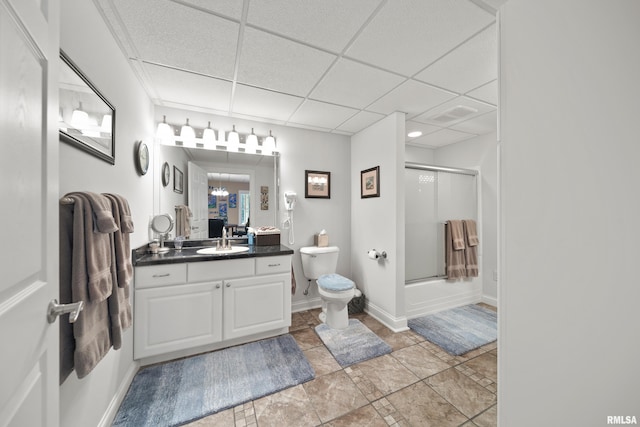 627 10th Ave, Silvis, IL 61282 - bathroom featuring vanity, a paneled ceiling, and combined bath / shower with glass door