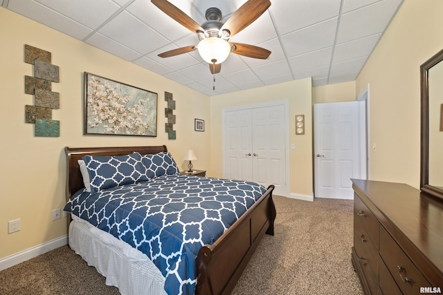 627 10th Ave, Silvis, IL 61282 - carpeted bedroom featuring a closet, a drop ceiling, and a ceiling fan