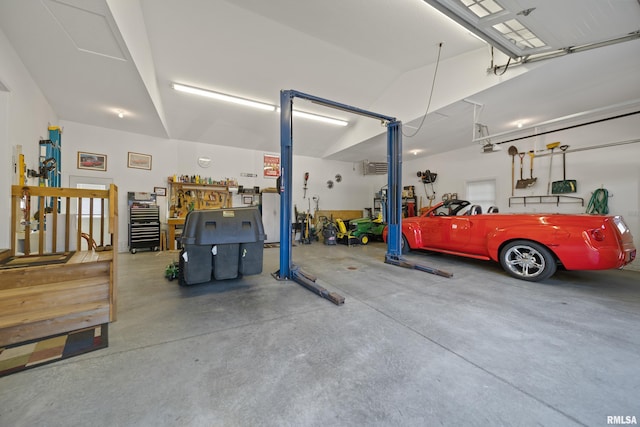 627 10th Ave, Silvis, IL 61282 - garage with a wall mounted air conditioner and a garage door opener