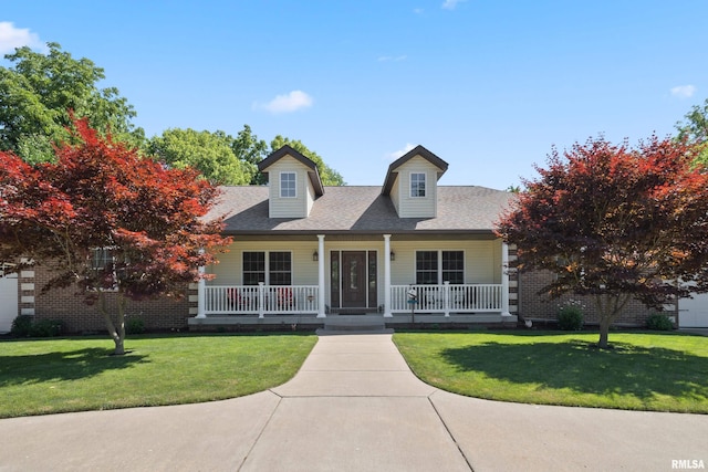627 10th Ave, Silvis, IL 61282 - new england style home featuring covered porch, a front yard, and roof with shingles