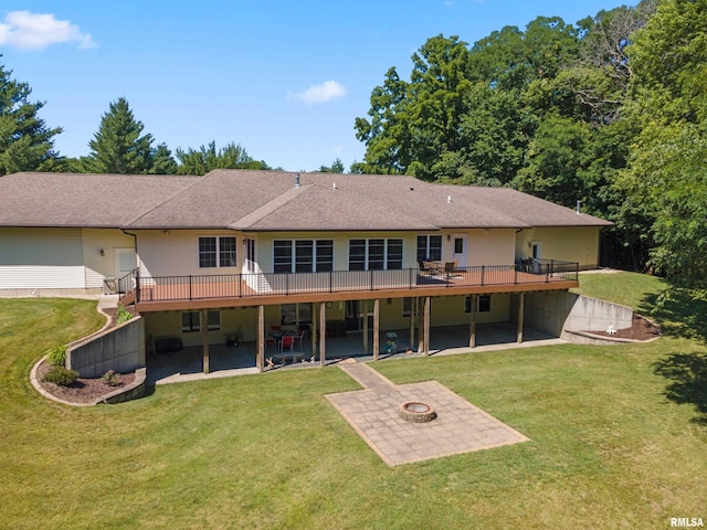 627 10th Ave, Silvis, IL 61282 - rear view of property with a patio, a fire pit, and a wooden deck