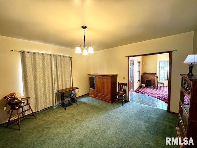 1626 210th St, Reynolds, IL 61279 - carpeted dining space featuring a chandelier
