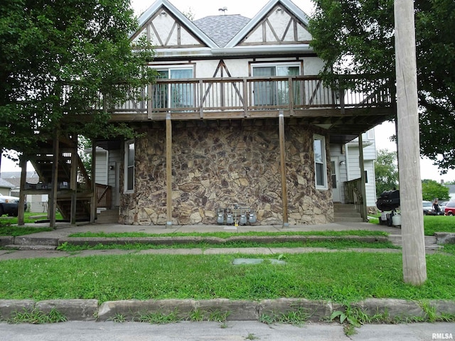 608-610 26th St, Rock Island, IL 61201 - townhome / multi-family property featuring stone siding and a wooden deck