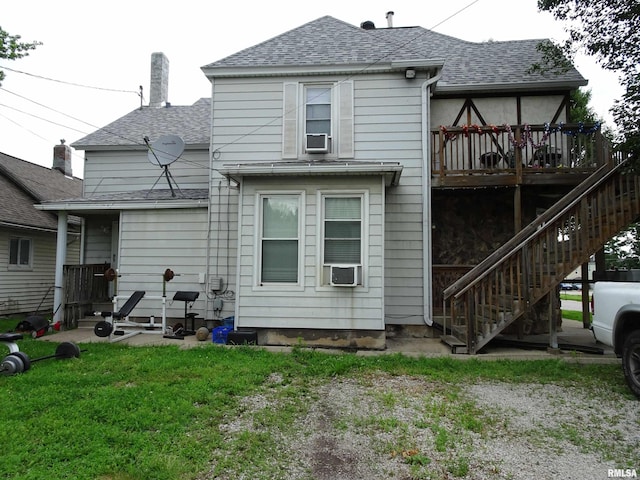 608-610 26th St, Rock Island, IL 61201 - rear view of property featuring a shingled roof, stairway, a yard, a chimney, and cooling unit
