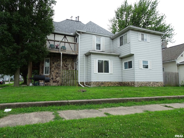 608-610 26th St, Rock Island, IL 61201 - back of property featuring a shingled roof and a balcony