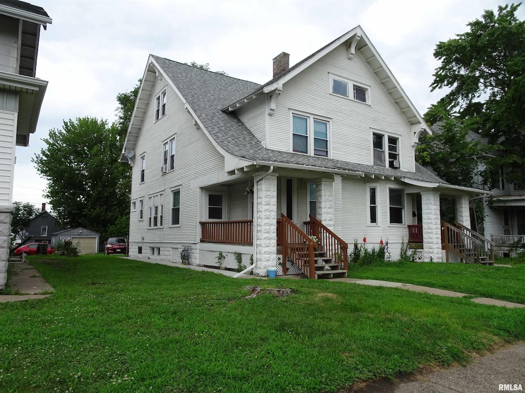 2529-2531 7th Ave, Rock Island, IL 61201 - view of front facade with a porch, roof with shingles, a chimney, and a front yard