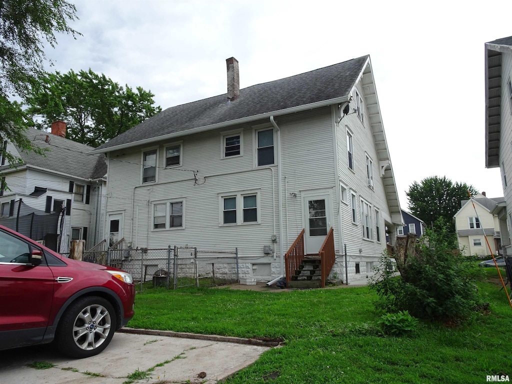 2529-2531 7th Ave, Rock Island, IL 61201 - rear view of property featuring entry steps and a chimney