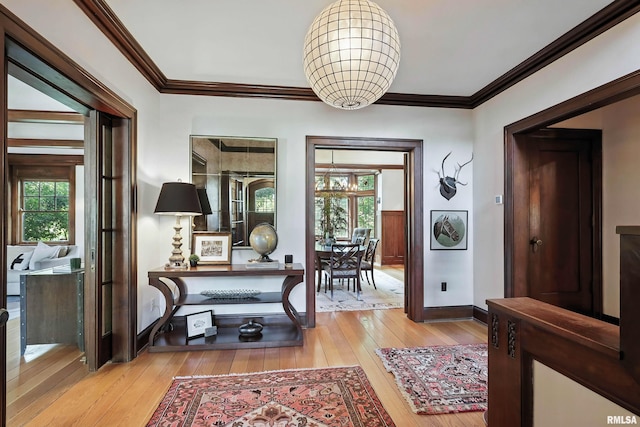 118 Ridgewood Ave, Davenport, IA 52803 - corridor featuring light wood-style flooring, a chandelier, and crown molding