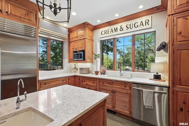 118 Ridgewood Ave, Davenport, IA 52803 - kitchen featuring stainless steel appliances, tasteful backsplash, recessed lighting, light stone counters, and a chandelier