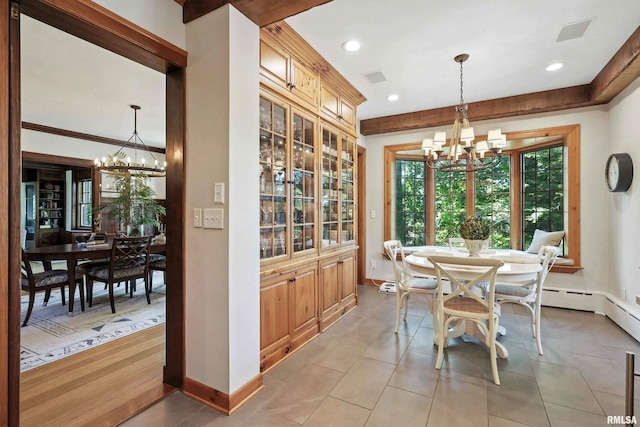 118 Ridgewood Ave, Davenport, IA 52803 - dining space featuring a chandelier, recessed lighting, and light tile patterned floors