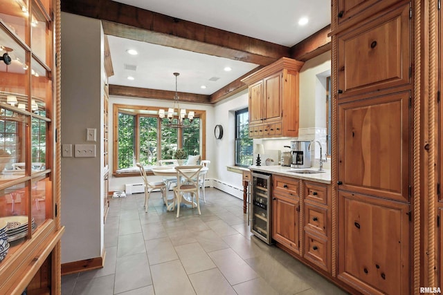 118 Ridgewood Ave, Davenport, IA 52803 - kitchen featuring wine cooler, a chandelier, light stone countertops, recessed lighting, and decorative light fixtures