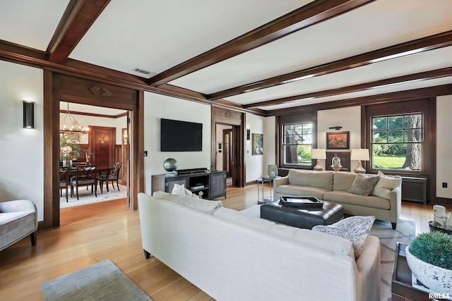 118 Ridgewood Ave, Davenport, IA 52803 - living room with a chandelier, beam ceiling, and light wood finished floors