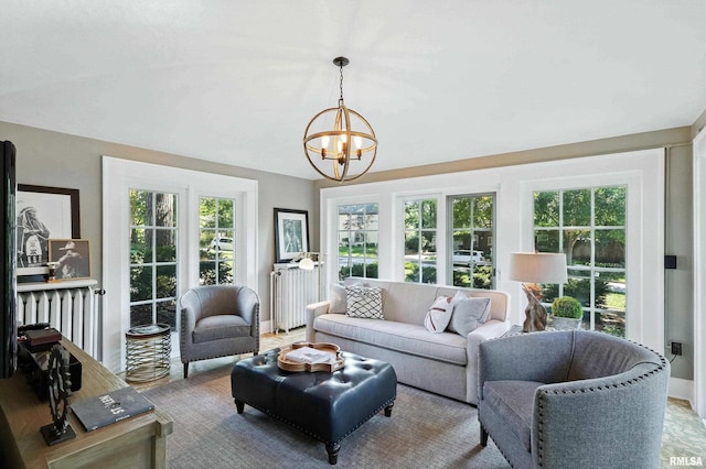 118 Ridgewood Ave, Davenport, IA 52803 - living area featuring a chandelier, radiator heating unit, and lofted ceiling