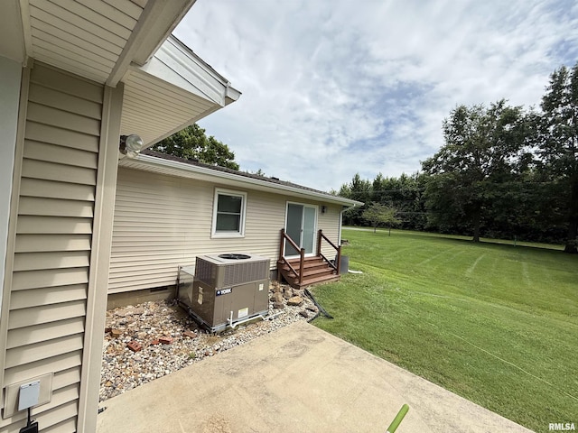15293 Wall St, Carterville, IL 62918 - view of grassy yard with entry steps and a patio