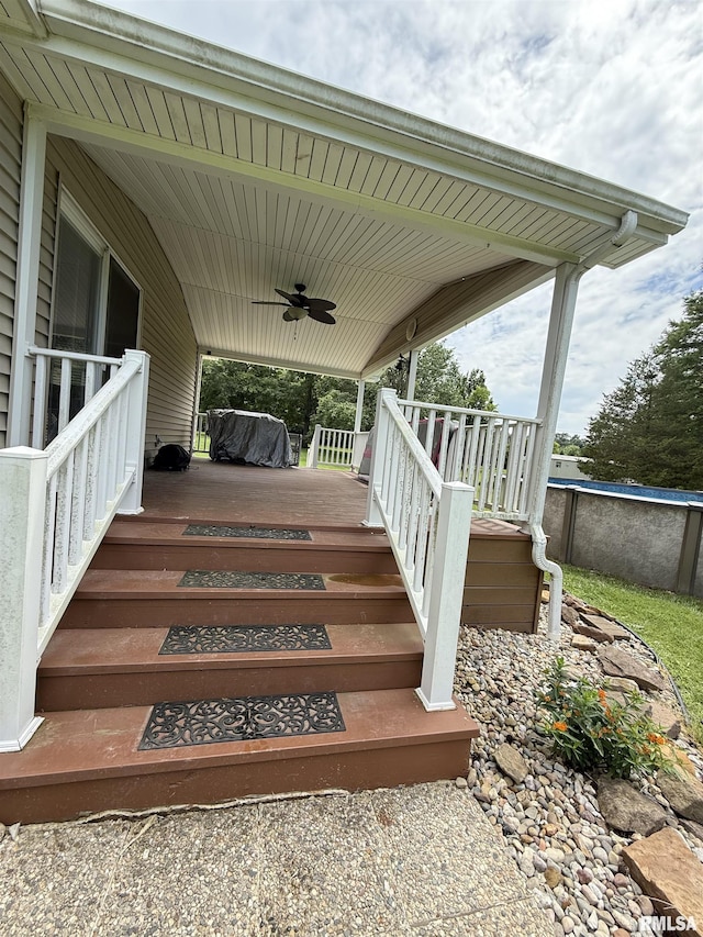 15293 Wall St, Carterville, IL 62918 - wooden terrace with a ceiling fan and stairway