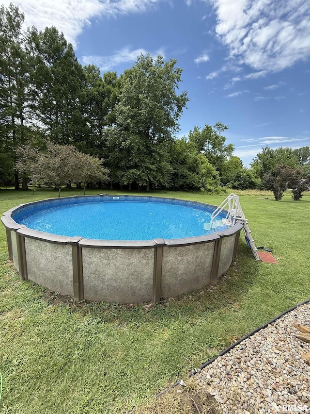 15293 Wall St, Carterville, IL 62918 - swimming pool featuring a yard and view of wooded area