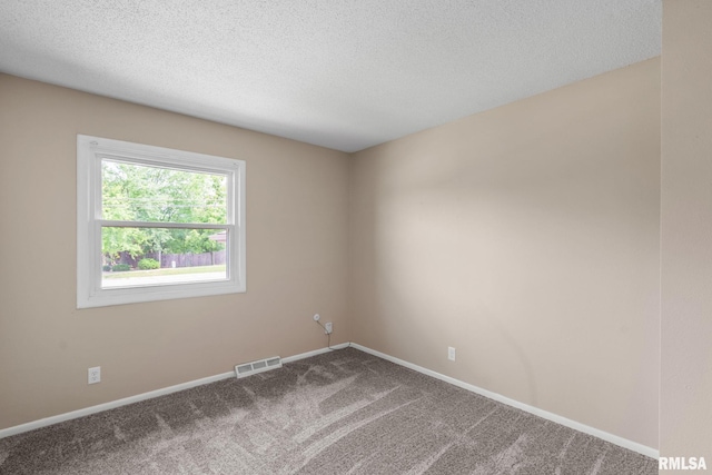 5210 N Division St, Davenport, IA 52806 - spare room featuring carpet and a textured ceiling