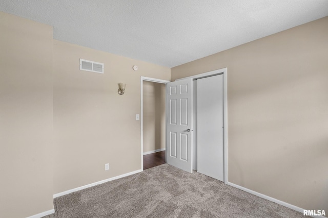 5210 N Division St, Davenport, IA 52806 - carpeted spare room with baseboards and a textured ceiling