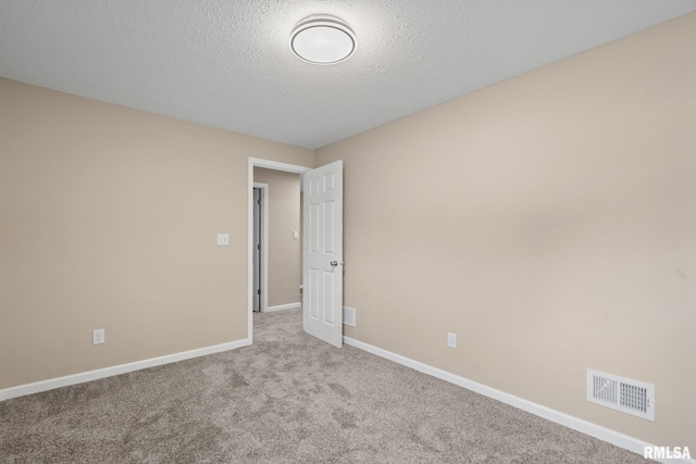 5210 N Division St, Davenport, IA 52806 - spare room with carpet floors and a textured ceiling