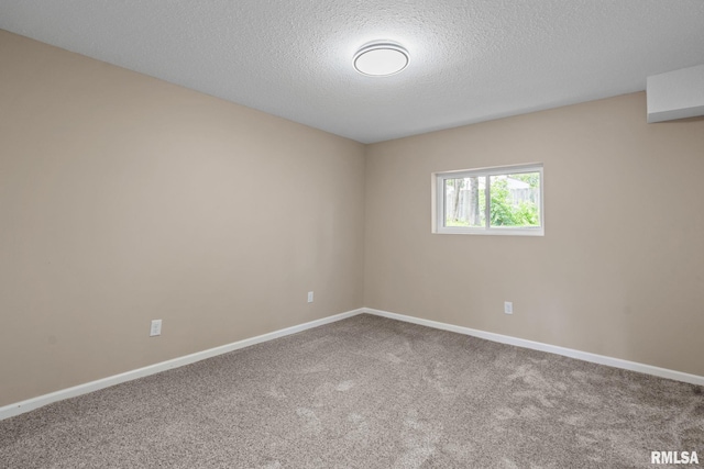 5210 N Division St, Davenport, IA 52806 - carpeted spare room featuring baseboards and a textured ceiling
