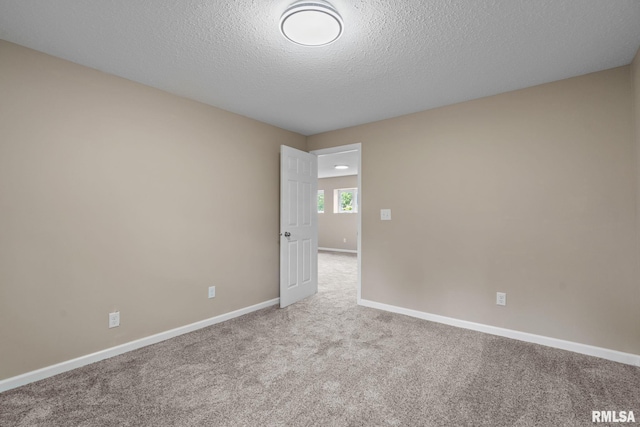 5210 N Division St, Davenport, IA 52806 - spare room with carpet flooring and a textured ceiling