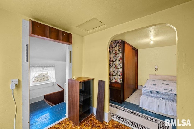 202 Washington Ave, Osco, IL 61274 - bedroom with attic access and a textured ceiling