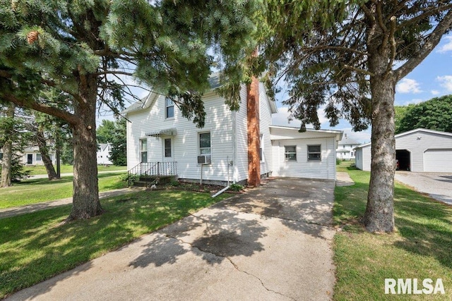 202 Washington Ave, Osco, IL 61274 - traditional home with a chimney, a front yard, an outbuilding, concrete driveway, and cooling unit