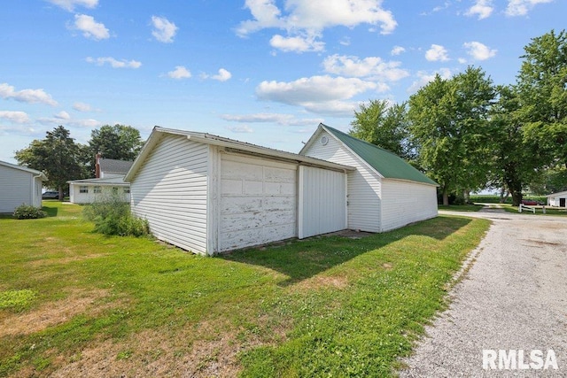 202 Washington Ave, Osco, IL 61274 - detached garage featuring driveway