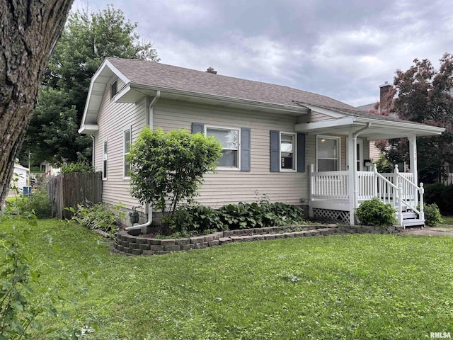170 16th Ave, East Moline, IL 61244 - view of front of house with a porch, a shingled roof, and a chimney