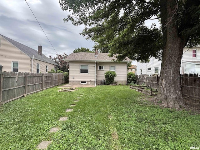 170 16th Ave, East Moline, IL 61244 - back of property with a fenced backyard and a patio