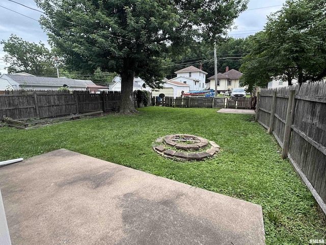170 16th Ave, East Moline, IL 61244 - fenced backyard featuring an outdoor fire pit and a patio