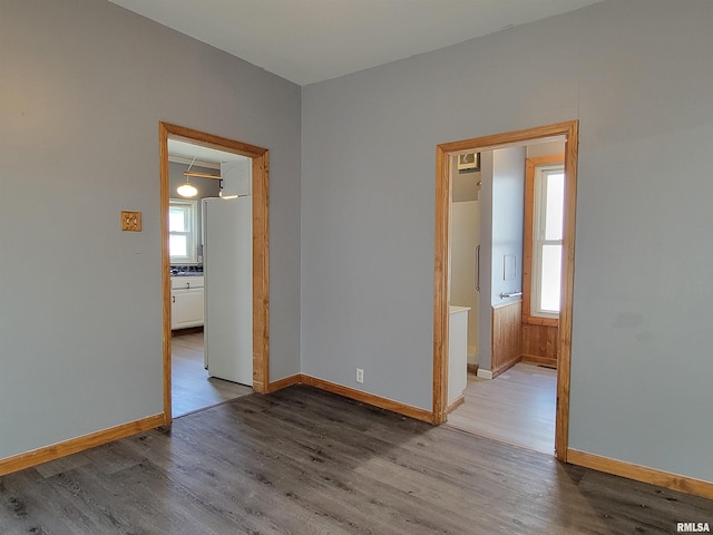 819 12th Ave S, Clinton, IA 52732 - unfurnished room with wood finished floors and baseboards