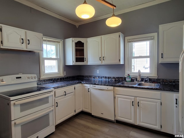 819 12th Ave S, Clinton, IA 52732 - kitchen featuring white appliances, white cabinetry, dark countertops, wood finished floors, and crown molding