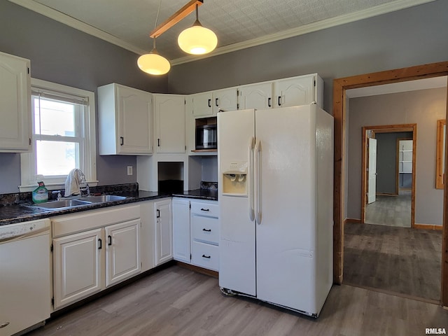 819 12th Ave S, Clinton, IA 52732 - kitchen with white appliances, ornamental molding, white cabinetry, light wood finished floors, and pendant lighting