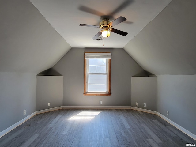 819 12th Ave S, Clinton, IA 52732 - additional living space featuring wood finished floors, a ceiling fan, and lofted ceiling