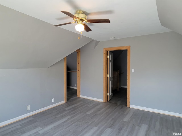 819 12th Ave S, Clinton, IA 52732 - bonus room featuring a ceiling fan, wood finished floors, and vaulted ceiling