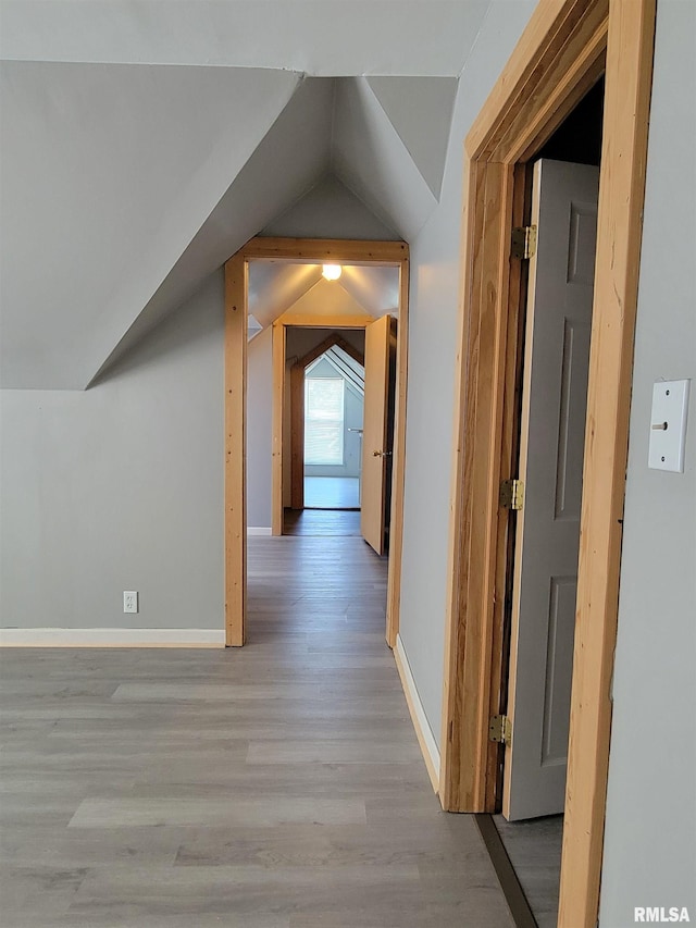819 12th Ave S, Clinton, IA 52732 - hallway with light wood-style floors and lofted ceiling