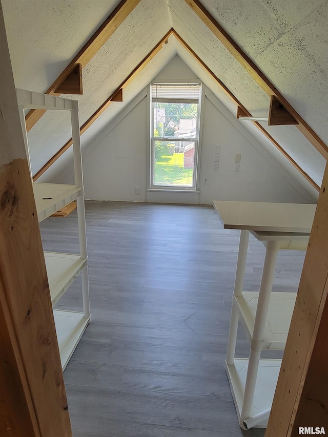819 12th Ave S, Clinton, IA 52732 - additional living space with lofted ceiling and wood finished floors