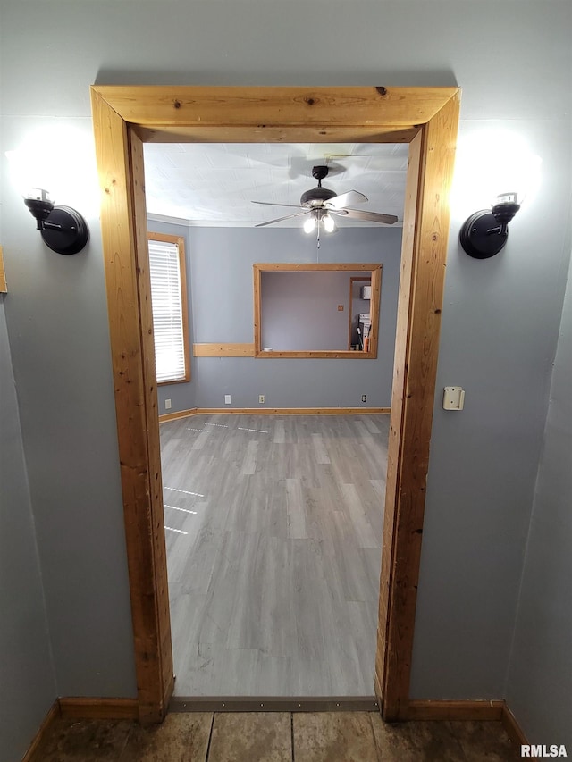 819 12th Ave S, Clinton, IA 52732 - corridor with baseboards and wood finished floors