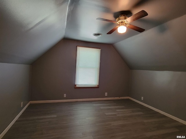 819 12th Ave S, Clinton, IA 52732 - bonus room featuring dark wood-style flooring, a ceiling fan, and vaulted ceiling