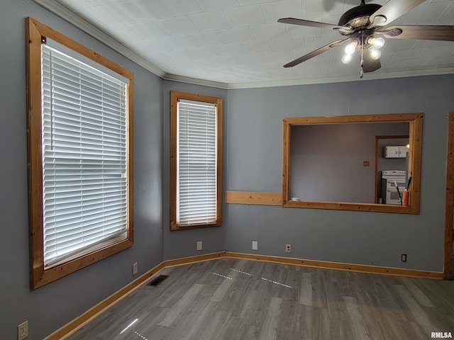 819 12th Ave S, Clinton, IA 52732 - unfurnished room with wood finished floors, ceiling fan, and ornamental molding