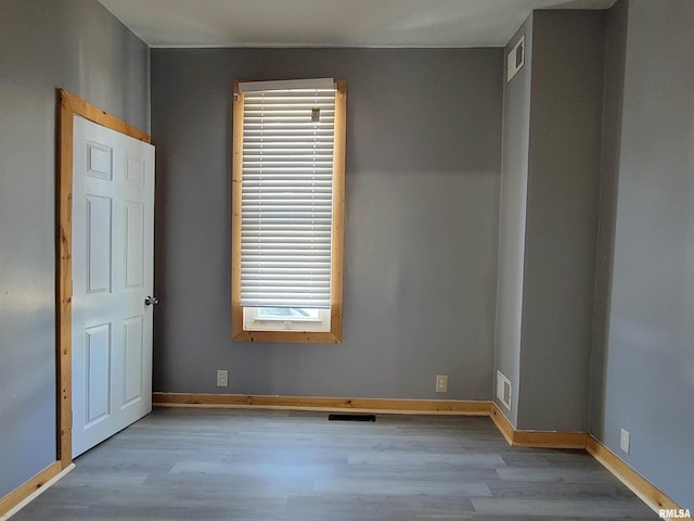 819 12th Ave S, Clinton, IA 52732 - spare room featuring wood finished floors