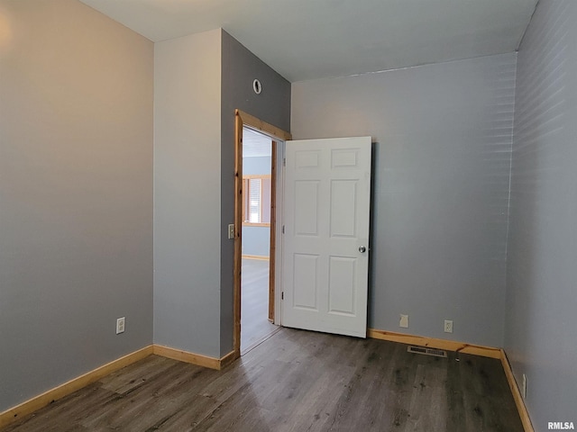 819 12th Ave S, Clinton, IA 52732 - empty room featuring wood finished floors