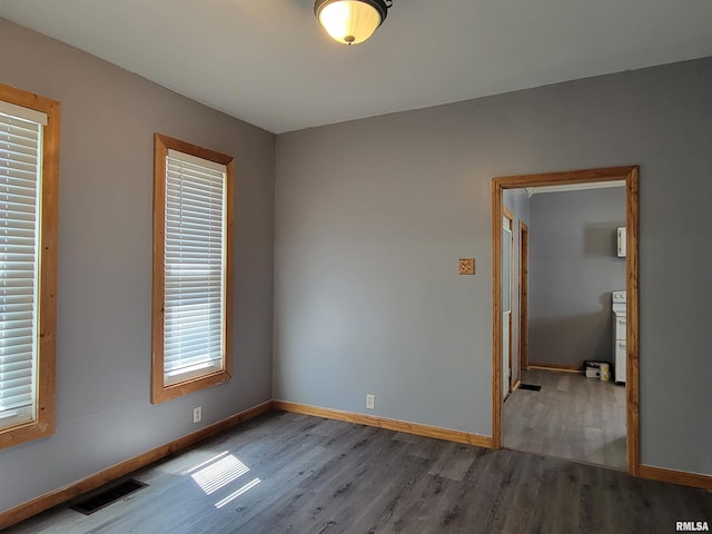 819 12th Ave S, Clinton, IA 52732 - spare room with wood finished floors