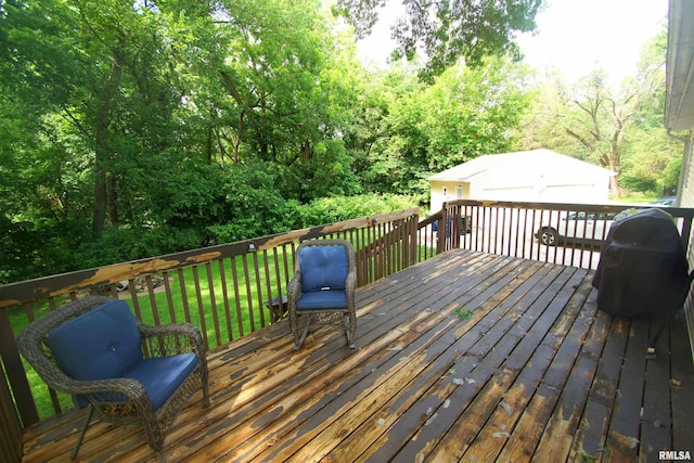 3422 Hobson Ave, Davenport, IA 52802 - wooden deck featuring an outbuilding, a lawn, and a garage
