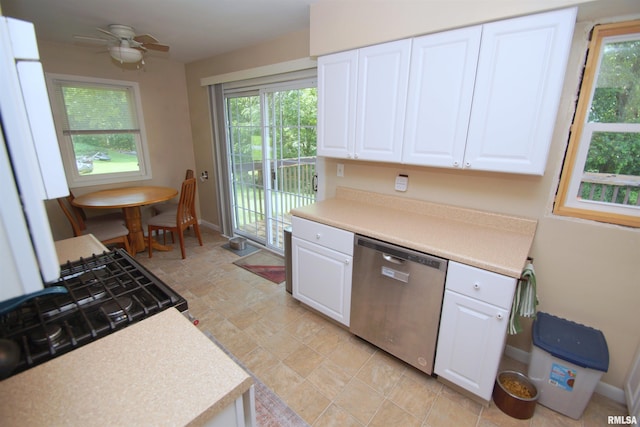 3422 Hobson Ave, Davenport, IA 52802 - kitchen featuring stainless steel dishwasher, white cabinetry, light countertops, and a ceiling fan