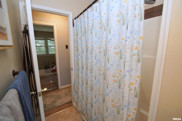 3422 Hobson Ave, Davenport, IA 52802 - bathroom with tile patterned flooring and a shower with curtain
