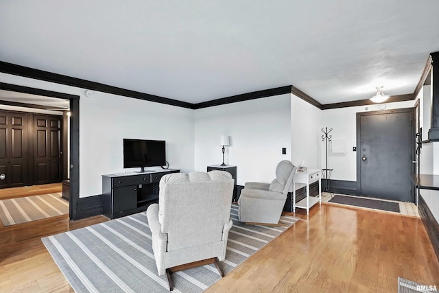 1800 7th St Unit 10E, East Moline, IL 61244 - living room featuring crown molding and wood finished floors
