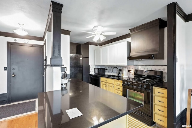 1800 7th St Unit 10E, East Moline, IL 61244 - kitchen featuring black appliances, dark countertops, a ceiling fan, decorative backsplash, and custom exhaust hood